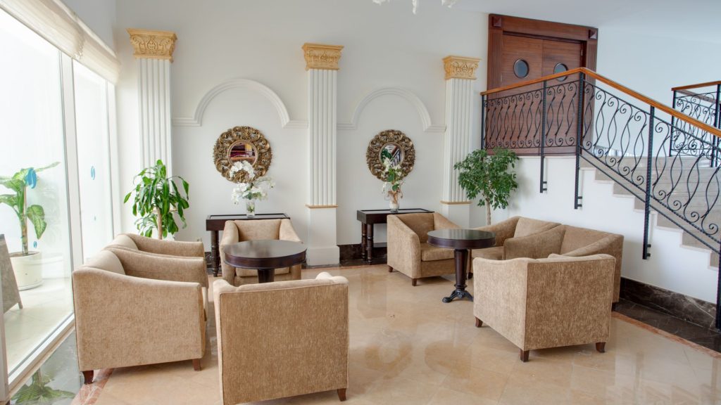 A room with several chairs and tables in it